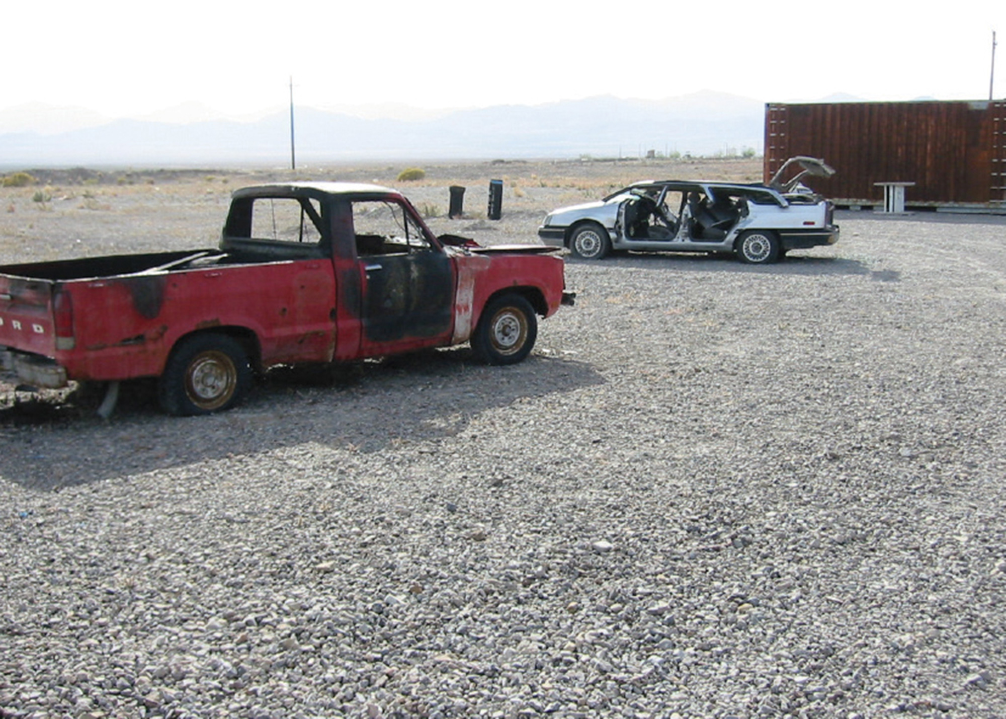 A photograph of destroyed emergency training prop cars.