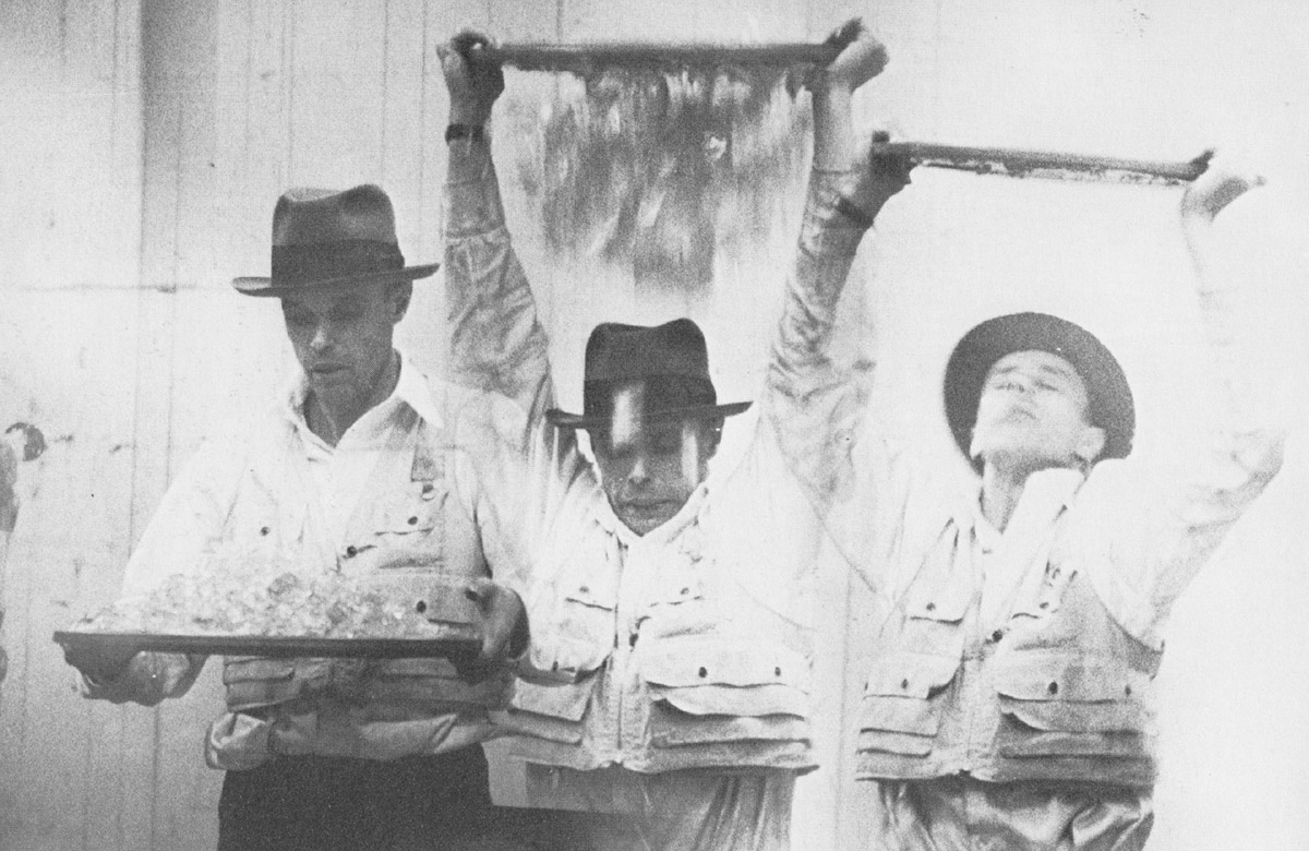 Photograph by Ute Klophaus of Joseph Beuys dumping gelatin on his head in the action entitled Celtic.