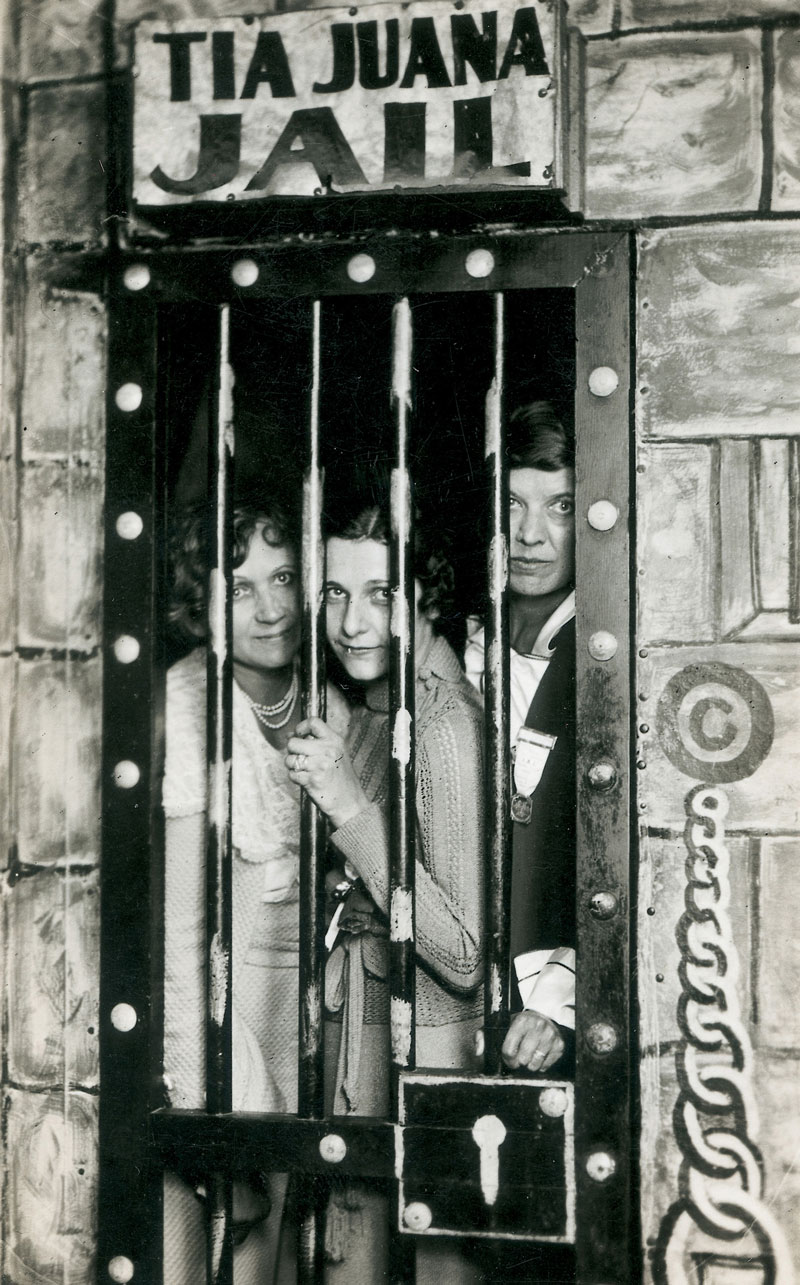 Tourists in Tijuana pose through the bars of a fake “Tijuana jail” for a souvenir photo postcard.