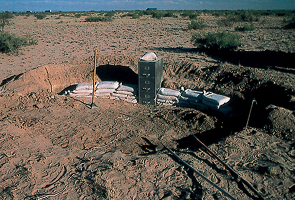 A photograph showing the early stages of the earthbag wall.