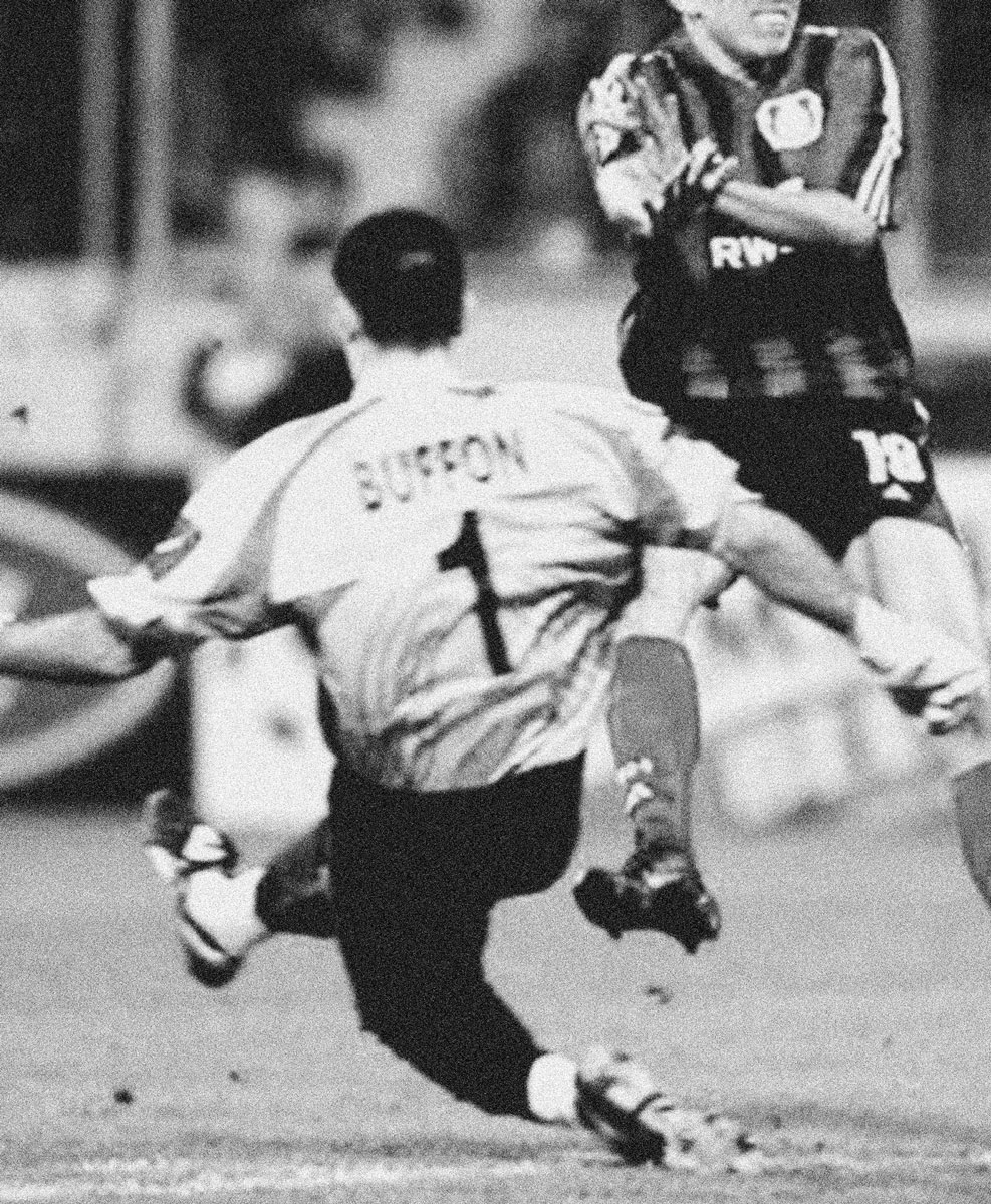 A photograph of two soccer players mid-game, one sporting a “Buffon” number 1 kit.