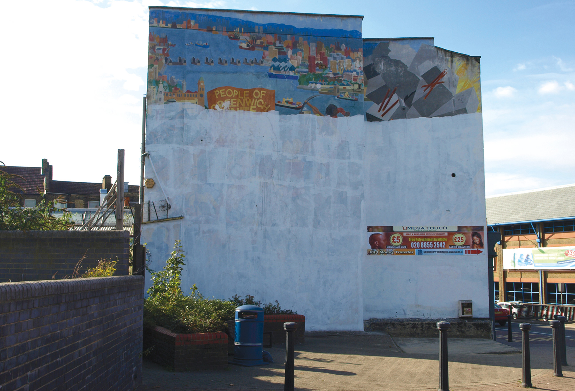 A photograph of an early to mid nineteen eighties mural by the Greenwich Mural Workshop on Woolwich High Street. 