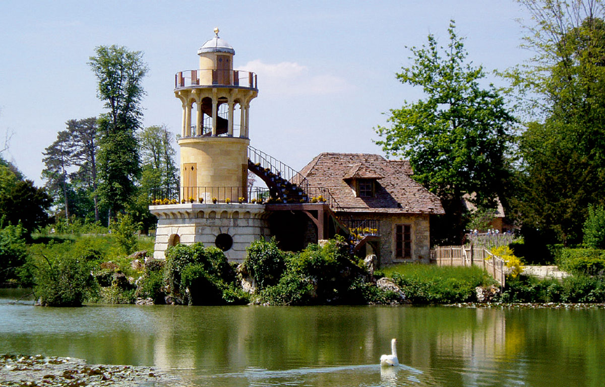 A photograph of the exterior of Marie-Antoinette’s pleasure dairy, which was designed by Richard Mique circa seventeen eighty-three to seventeen eighty-seven.