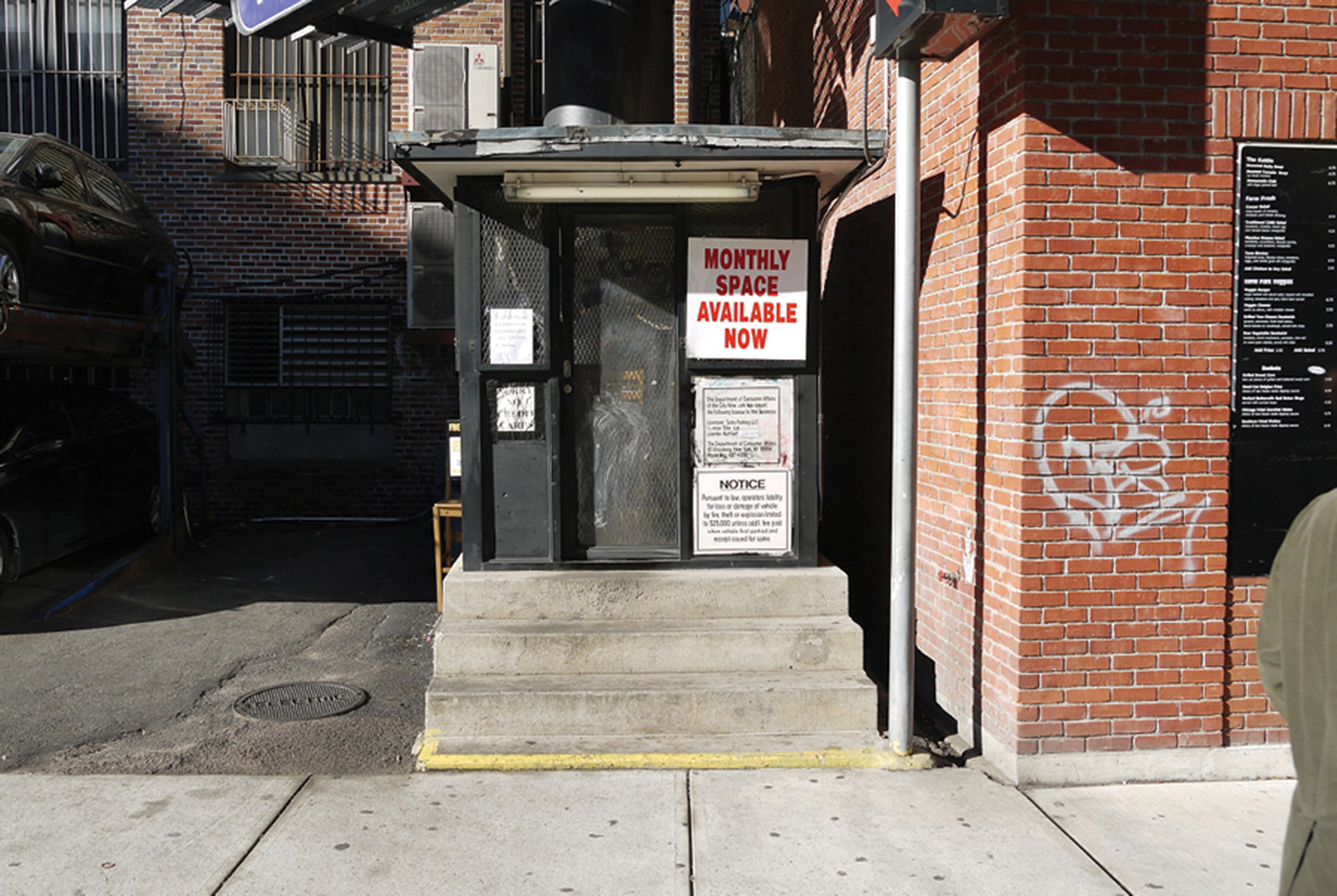 A photograph of a valet booth on Lafayette Street, between Prince and Spring Streets, in New York City.