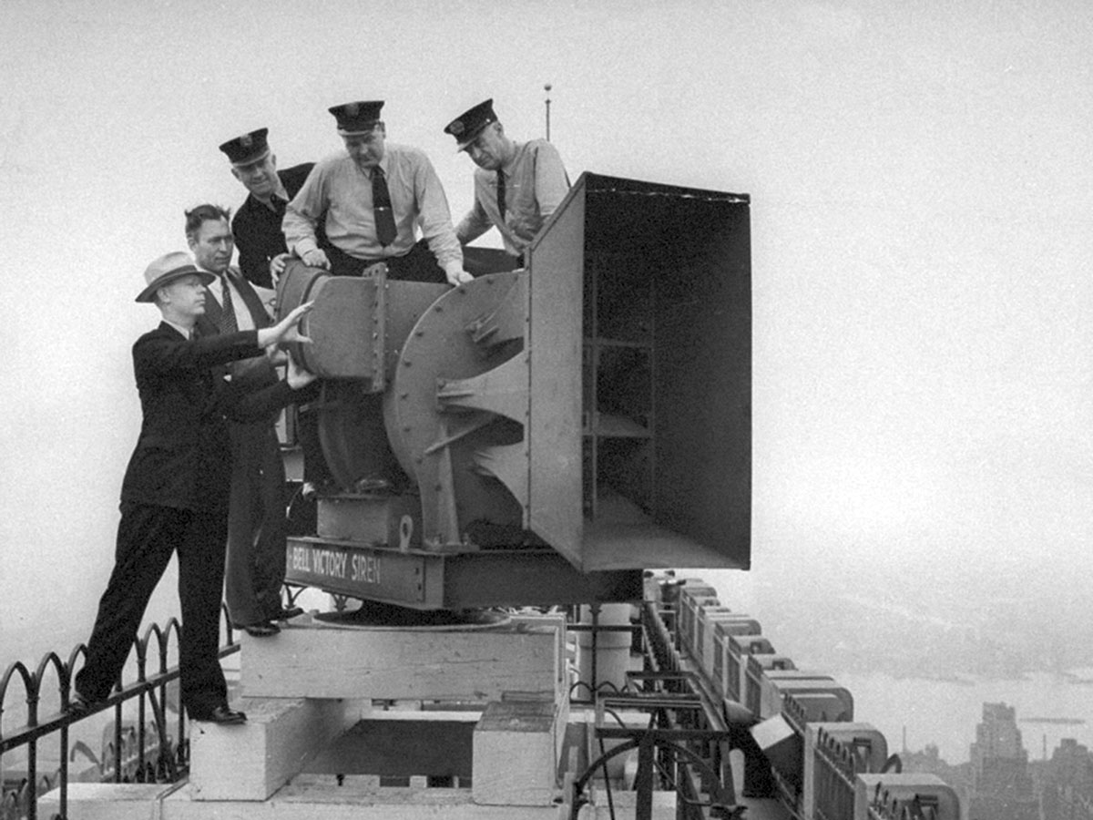 A circa nineteen forties photograph of a Chrysler-Bell Siren being installed on top of the RCA Building in New York City.