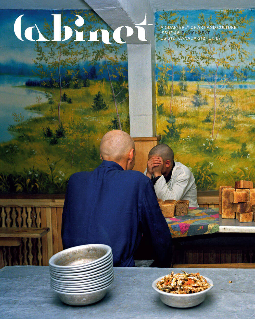 A photograph of two prisoners seated at a dining table in labor camp number twenty in Krasnoyarsk, Siberia.