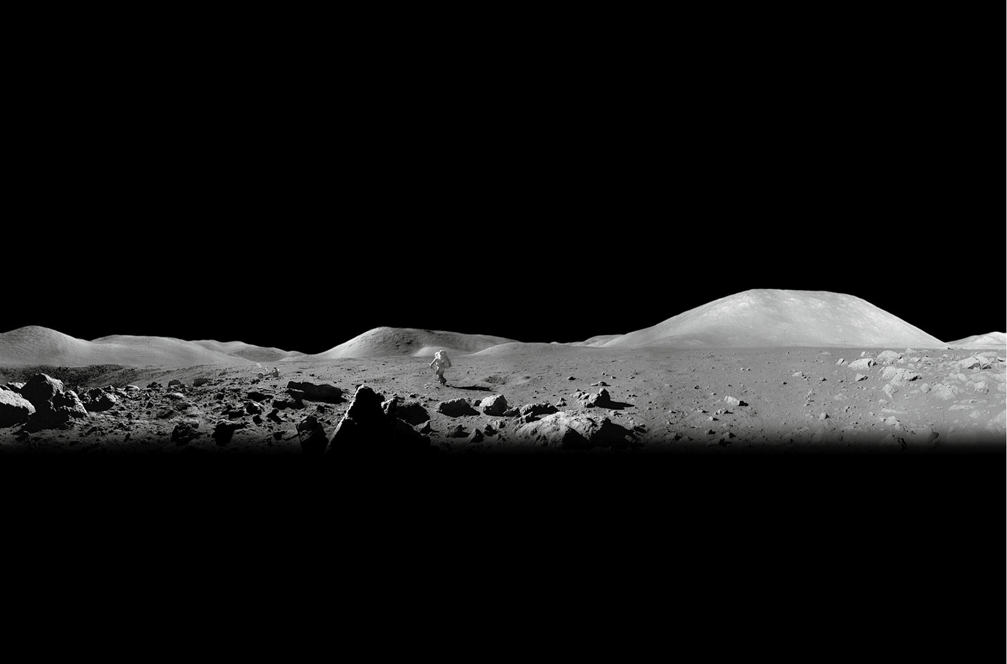 A December nineteen seventy-two photograph of Apollo 17 Astronaut Harrison Schmitt running toward the dark side of the moon.