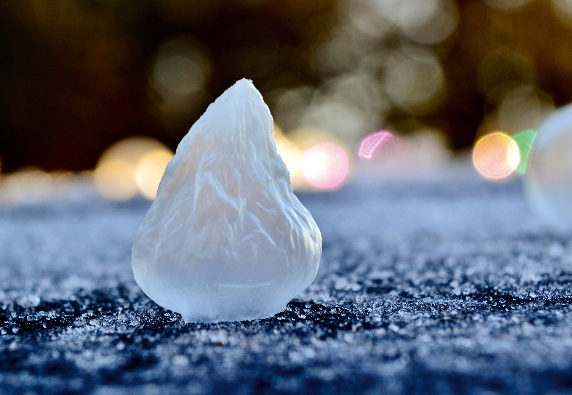 A photograph of a frozen collapsing bubble.