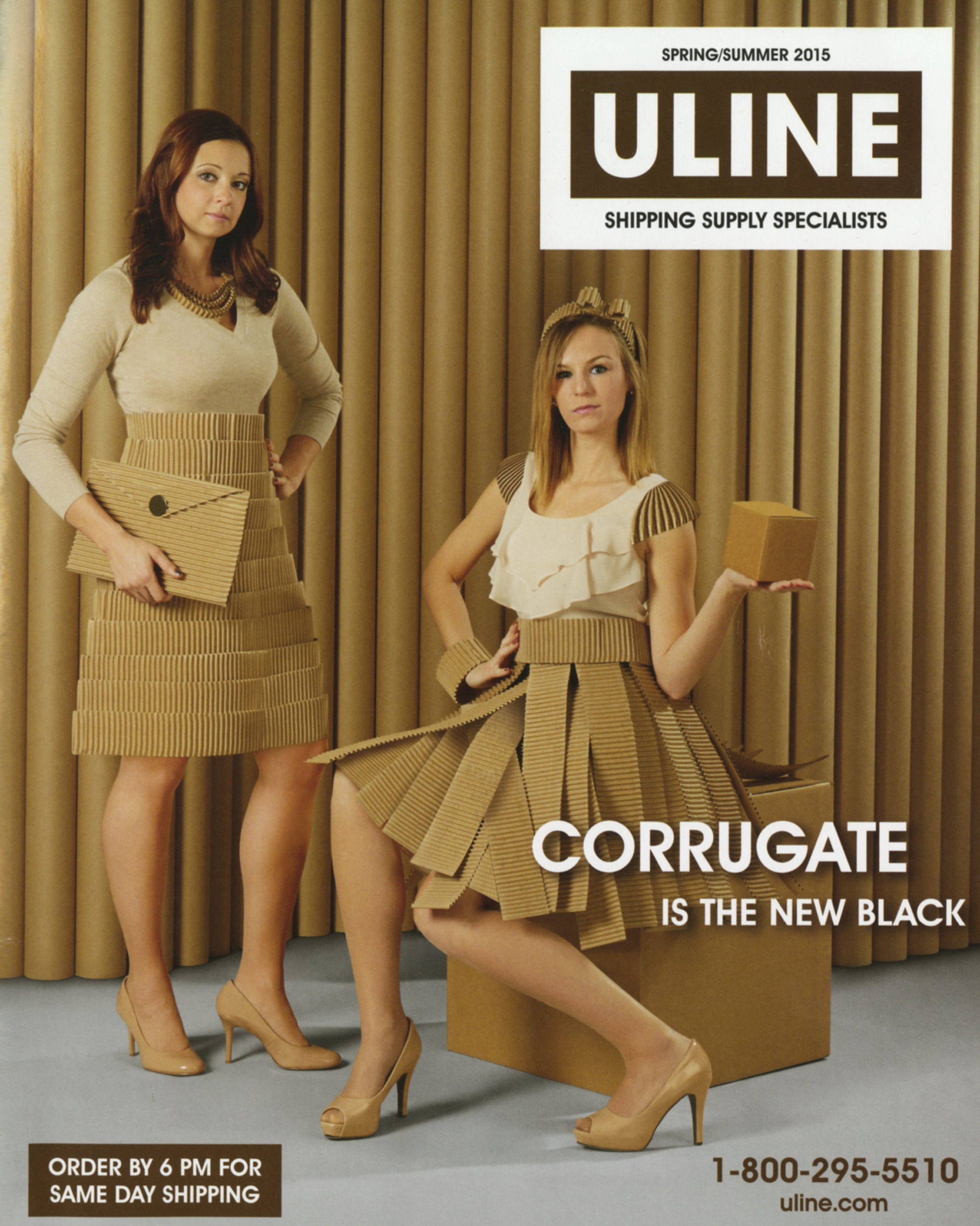 An advertisement for a shipping company named Uline, depicting two women dressed in corrugate packaging. 