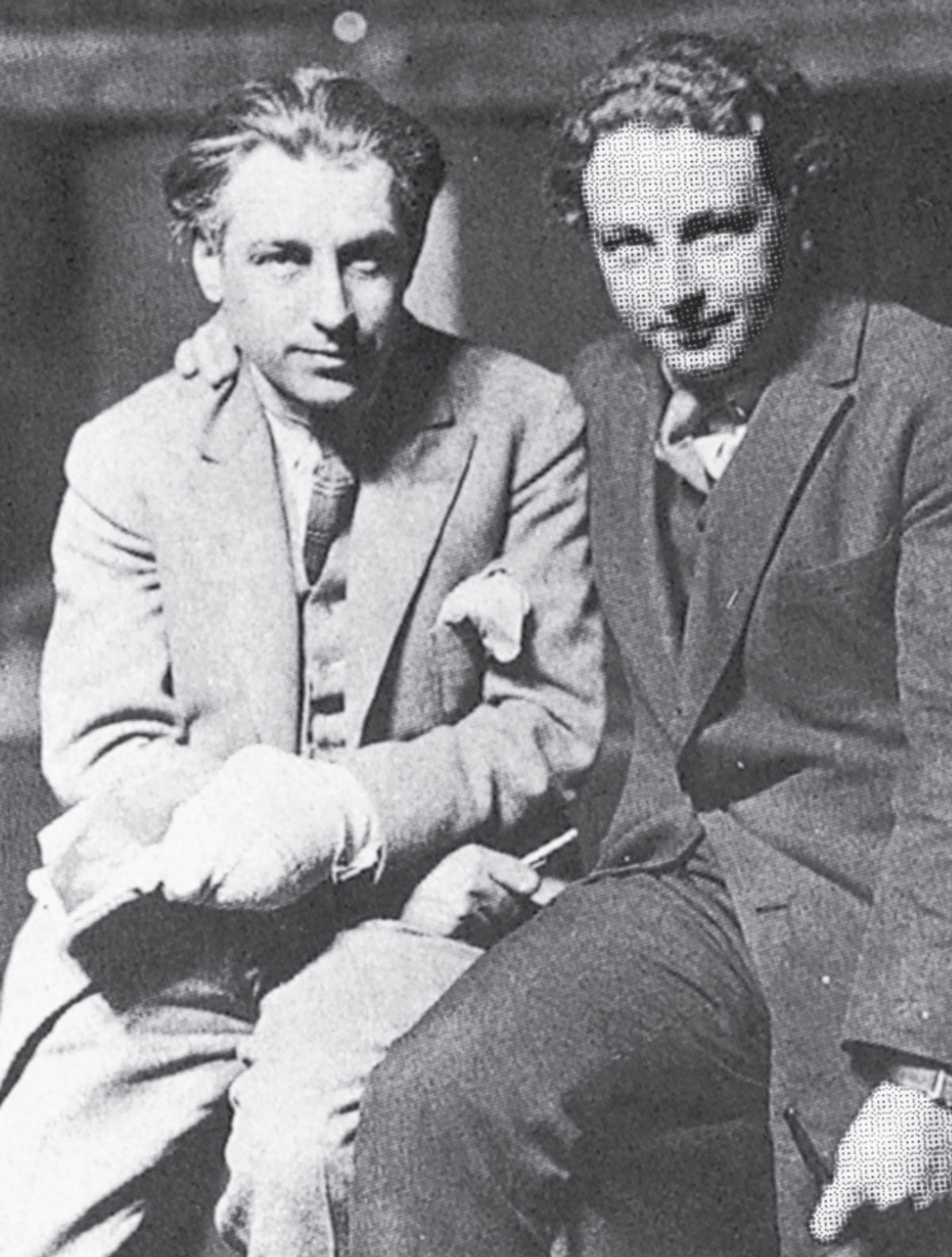 A photograph of Ernst Moiré and friend. As with all images of the photographer, his face is covered by a Moiré pattern.