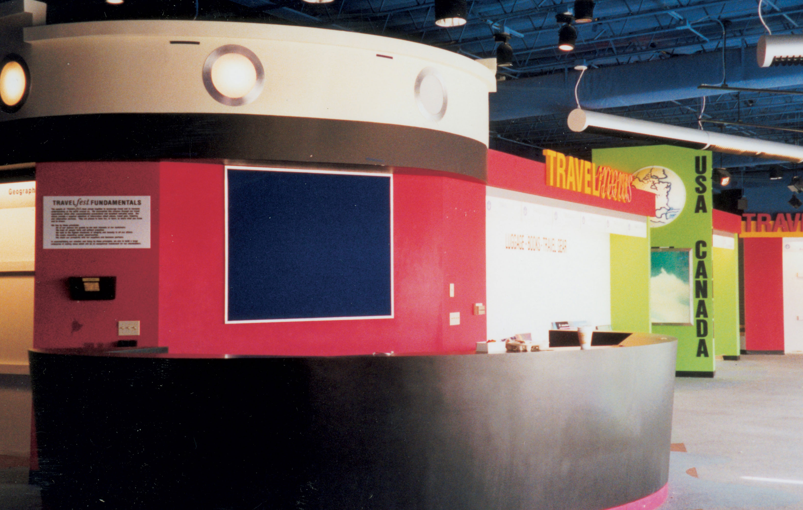 A photograph of the empty interior of an abandoned travel agency.