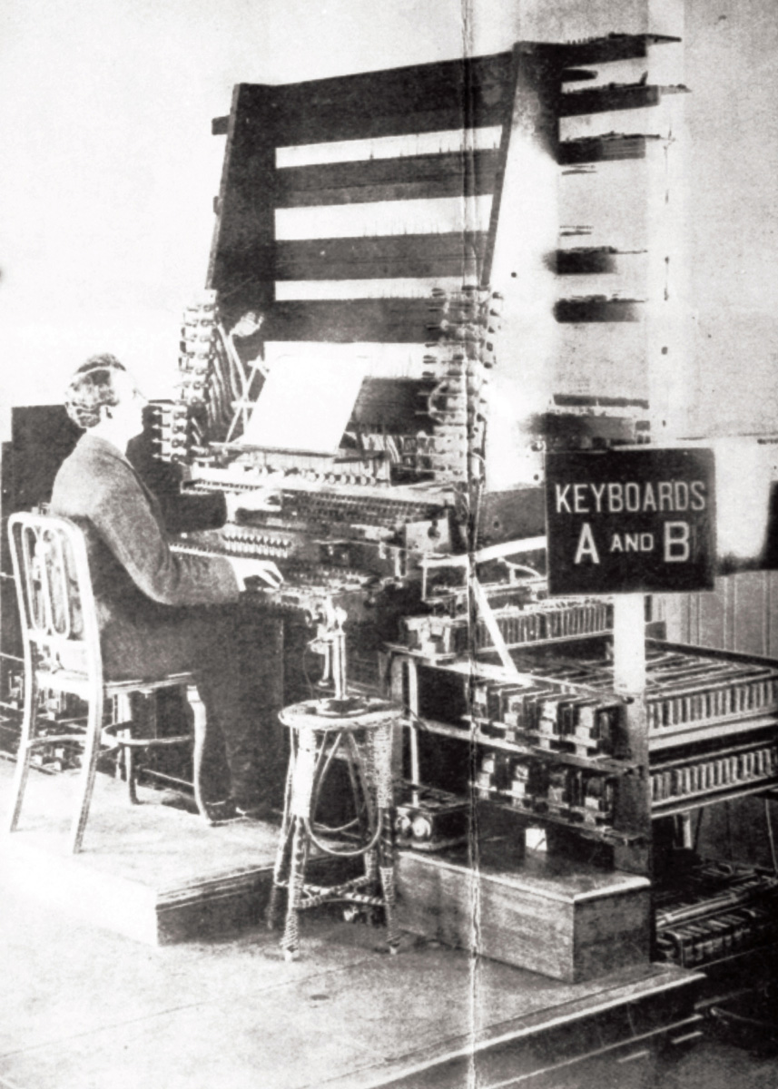 A 1907 photograph of a musician playing at the Telharmonic Hall. 